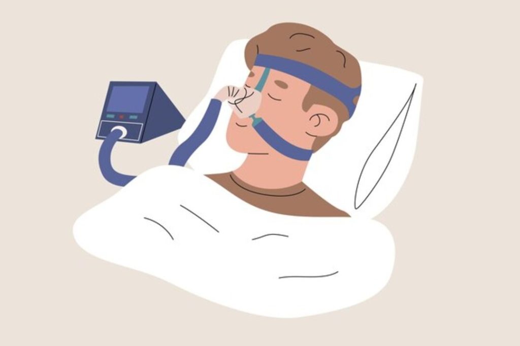 Man sleeping with CPAP machine for sleep apnea treatment.
